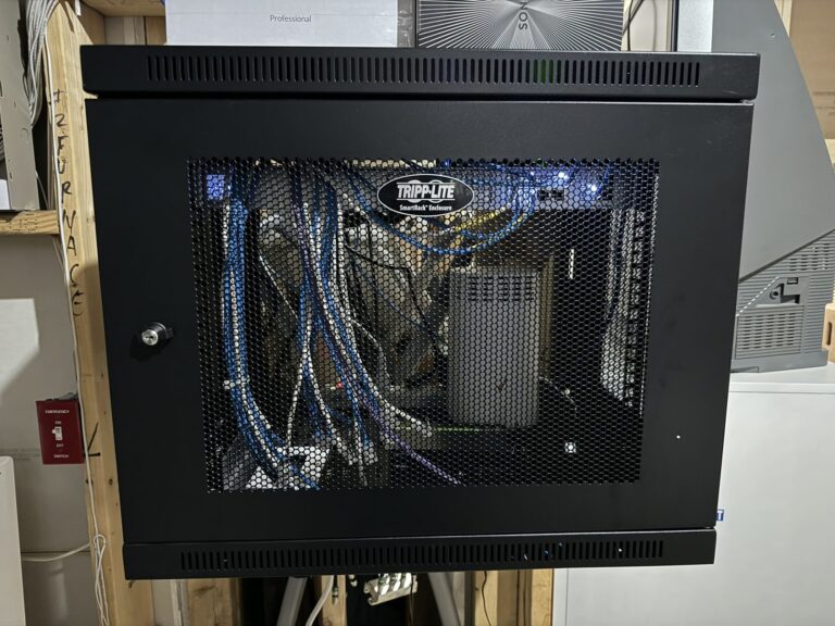 Network rack before cleanup, tangled cables