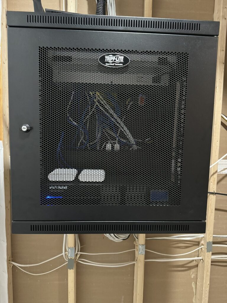 Network rack after cleanup, neatly dressed cables