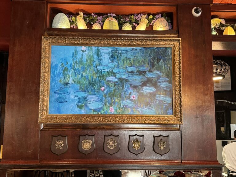 Frame TV showing a Monet painting in a gilded frame at Martin's Tavern, Georgetown